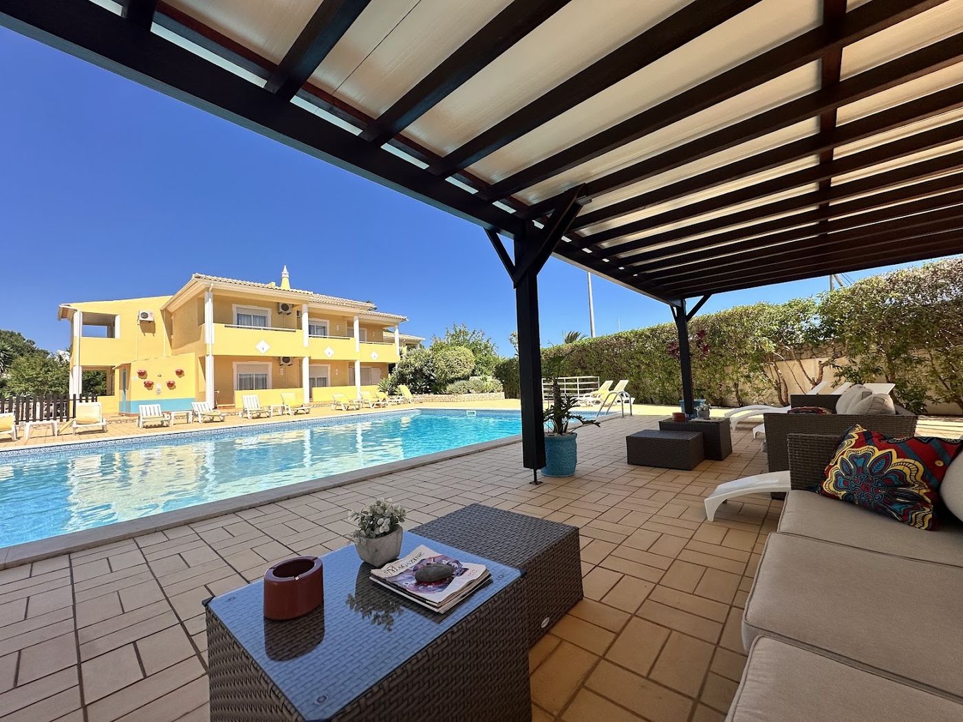 Pool terrace with pergola lounge